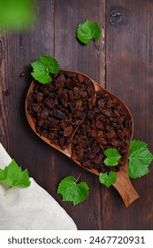 rustic still life with dried raisins in a bowl on the table