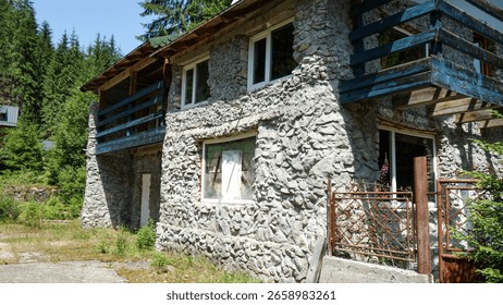 Rustic stone house in a forest setting