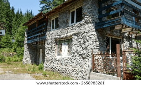 Rustic stone house in a forest setting