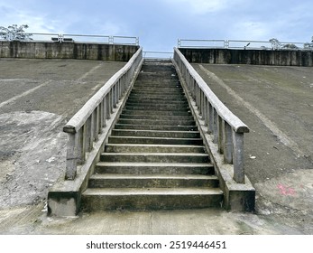 Rustic stone stairs wind gracefully through the landscape, providing a sturdy and natural path for ascending or descending with ease.
