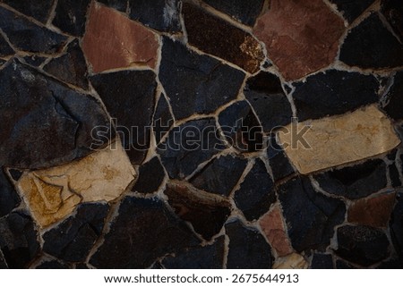 Rustic Stone Wall Texture with Irregular Black and Brown Paving