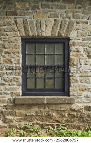Rustic Stone Wall with Vintage Window.