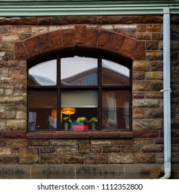 Rustic store front with window with open sign