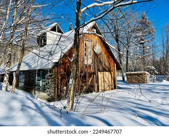 Rustic Sugar Shack in the province of Quebec in Canada on a beautiful winter day. 