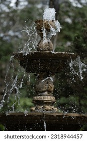 RUSTIC WATER FOUNTAIN IN NATURE