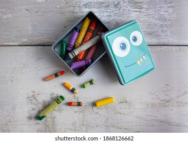 rustic wax crayons box wood background top view