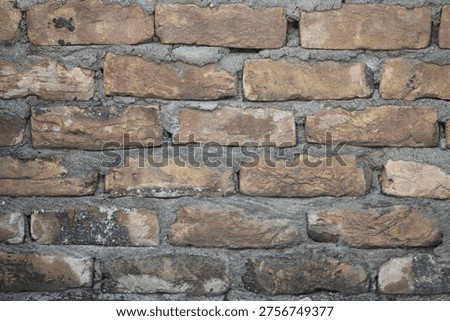 Rustic Weathered Brick Wall with Coarse Mortar Joints