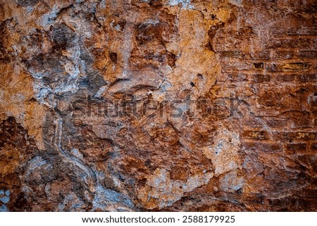 Rustic Weathered Stone Texture with Orange, Anthracite, Ochre, and Copper Tones – High-Contrast Rock Surface with Natural Patterns for Backgrounds and Design