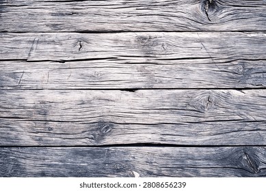 Rustic weathered wood wall background with horizontal planks and prominent knotholes