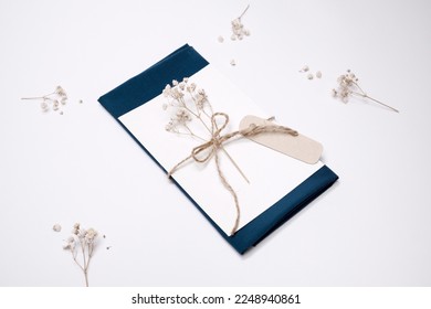 Rustic wedding invitation mock up, postcard template decorated with name tag and stylish kraft rope - Powered by Shutterstock