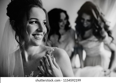 Rustic wedding morning preparation. bridal getting ready. Wedding help. Hands of bridesmaids on bridal dress. Happy marriage and bride at wedding day concept.