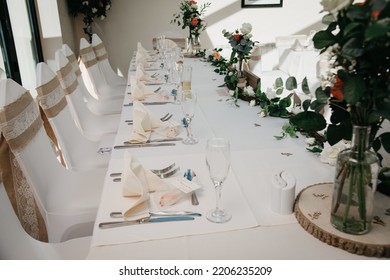 Rustic Wedding Reception Top Table Seating With Glasses, Cutlery And Dishes