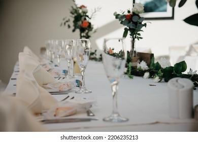 Rustic Wedding Reception Top Table Seating With Glasses, Cutlery And Dishes