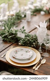 Rustic wedding table setting with golden accents