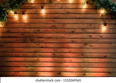 rustic wedding, wooden chairs, beautiful decor, light bulbs - Powered by Shutterstock