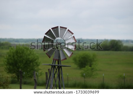 Rustic Windmill in a Farm Field