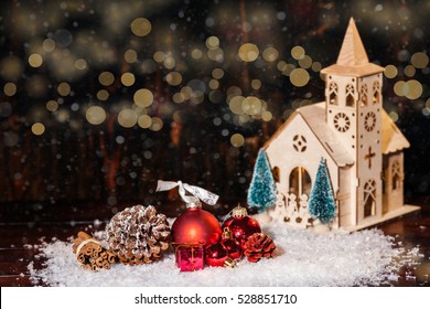 Rustic Winter Christmas Scene With Church And Gifts