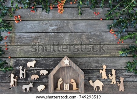 rustic wood background with christmas manger scene