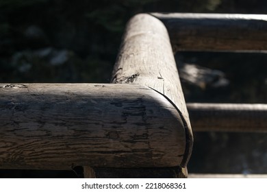 Rustic Wood Fence Corner With Heavy  Light And Shadow. Park Fence Or Cabin Patio Railing. Selective Focus. North Vancouver, Canada.