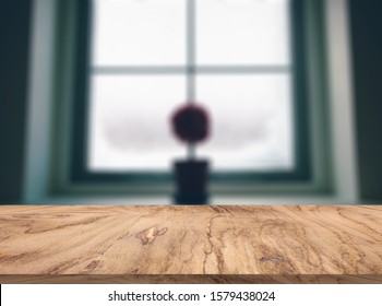 rustic wood table in front of christmas light night
