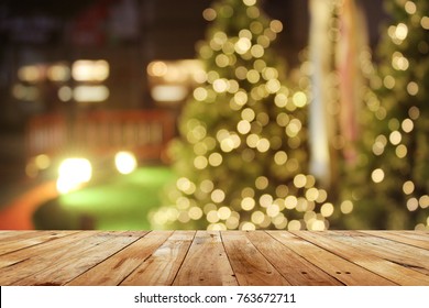 Rustic Wood Table In Front Of Christmas Light Night,abstract Circular Bokeh Background
