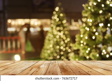 Rustic Wood Table In Front Of Christmas Light Night,abstract Circular Bokeh Background
