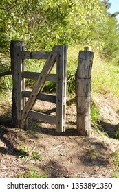 Rustic wooden gate and gate posts on a cattle property	