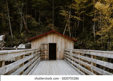 Rustic Wooden Hut Or Shelter On The Bridge In Hautes Gorges De La Rivière-Malbaie National Park, Canada. Hiking Trail In The Mountains, Concept Of Wilderness And Wanderlust