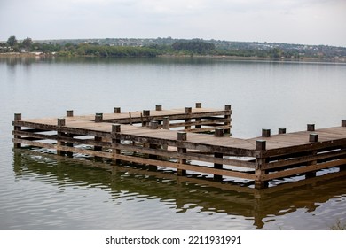 Rustic Wooden Pier Over Freshwater Lake In Selective Focus. Paranoá Lake Brasília Df