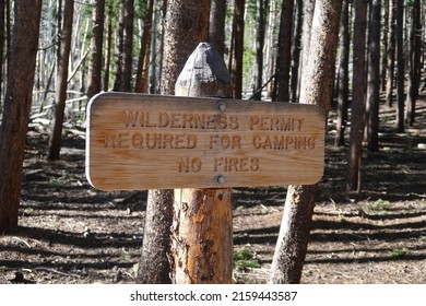 Rustic Wooden Sign For Bierstadt Lake Trail At Rocky Mountain National Park. Wilderness Permit Required For Camping. No Fires.