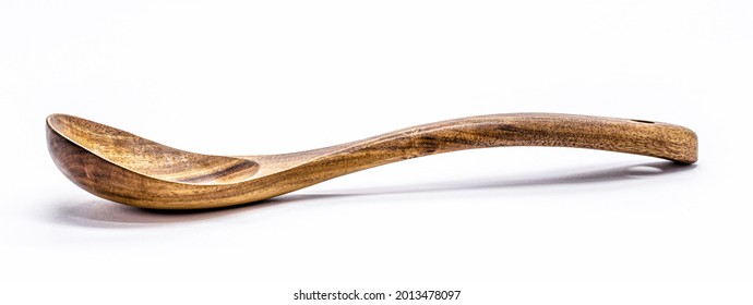 rustic wooden spoon on isolated white background, profile view. - Powered by Shutterstock