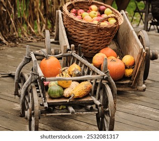 Rustic wooden wagon overflowing with autumn harvest - pumpkins, apples, gourds. Perfect for Thanksgiving, fall, harvest, and country themes. - Powered by Shutterstock