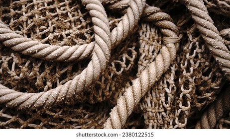 rustic worn fishing net as background - Powered by Shutterstock