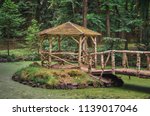 Rustical gazebo at Vysoka, Antonin Dvorak Memorial park in middle of small lake