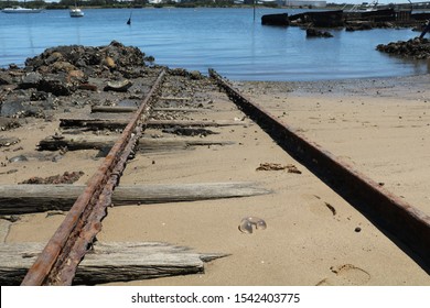 Rusting Rail Line Running Into The Hunter River Newcastle Australia