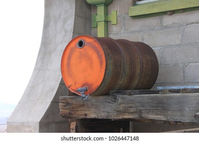 Rusty 50 Gallon Drum Outside Old Building