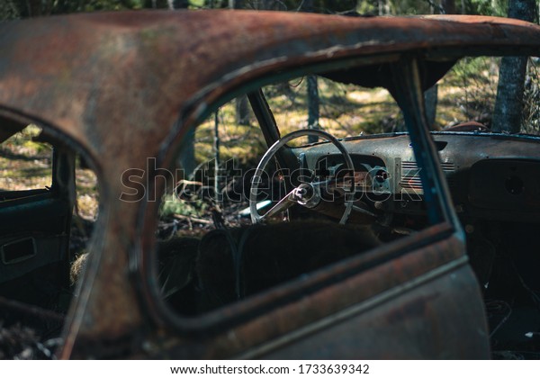 Rusty abandoned cars, car\
graveyard