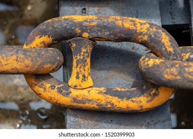 Rusty anchor chain in dry dock