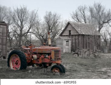 Rusty Antique Red Tractor on Farm - see more in portfolio - Powered by Shutterstock