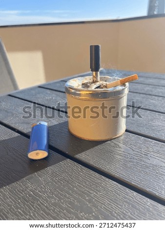 Rusty Ashtray with cigarette lighter 