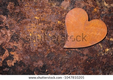 rusty background with rusty heart, copyspace for own text