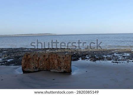 rusty barrel washed up on the beach
