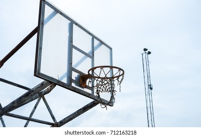rusty basketball hoop in slum park 