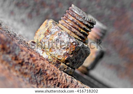 Rusty bolt with nut.