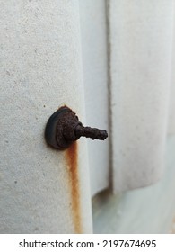 Rusty Bolt Stuck To Asbestos