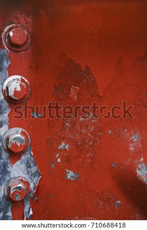 Rusty bolts and nuts on an old machinery
