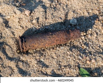 Rusty Bullet Shell On Sand