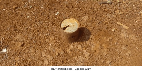rusty cans in the barren land