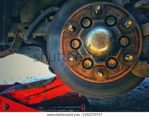 Rusty car\
brake, Old  disk break, Remove the\
wheel.