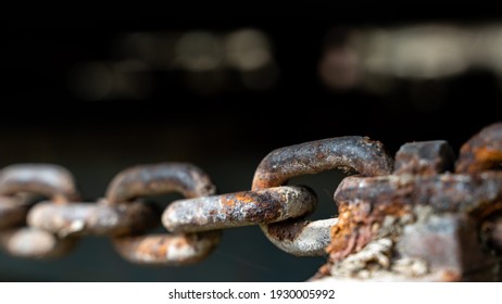 Rusty Chain From Agricultural Machinery With Dark Background